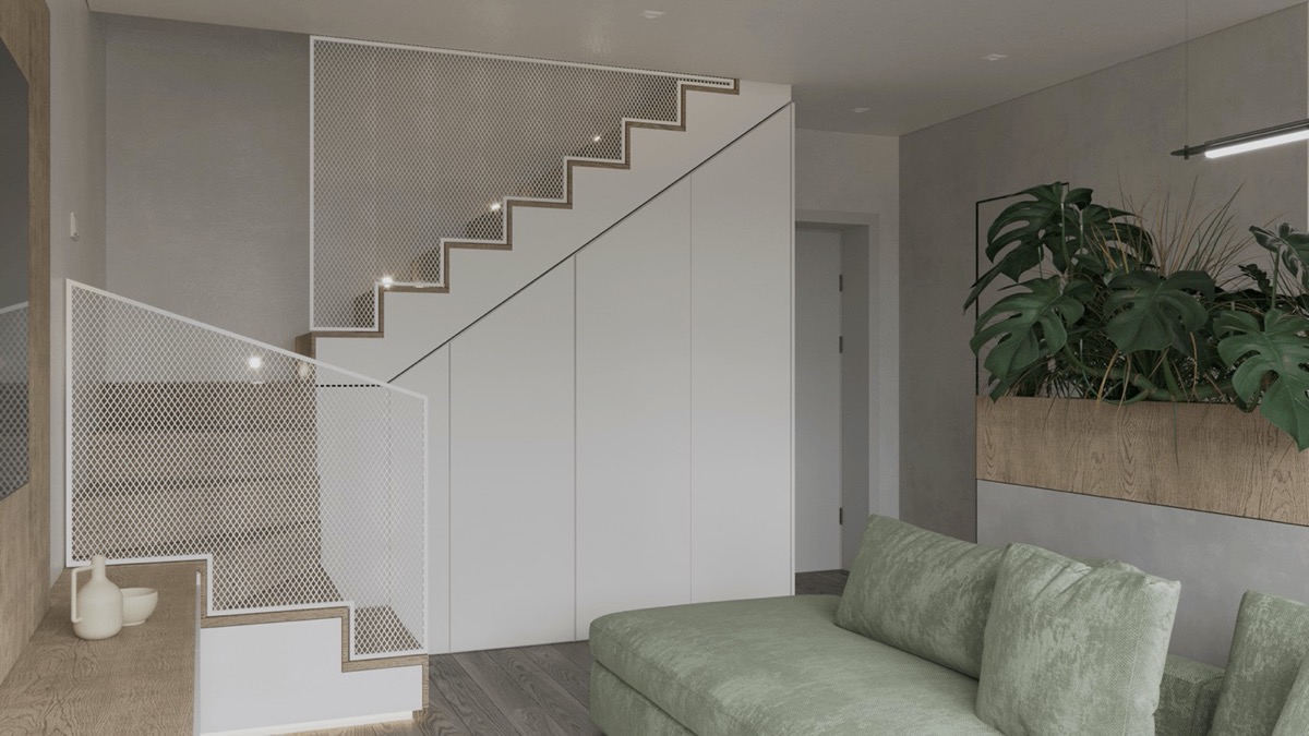 hình ảnh phòng khách và cầu thang lên gác lửng căn hộ với lan can bằng lưới màu trắng, tủ lưu trữ dưới dgaamf càu thang cùng tông