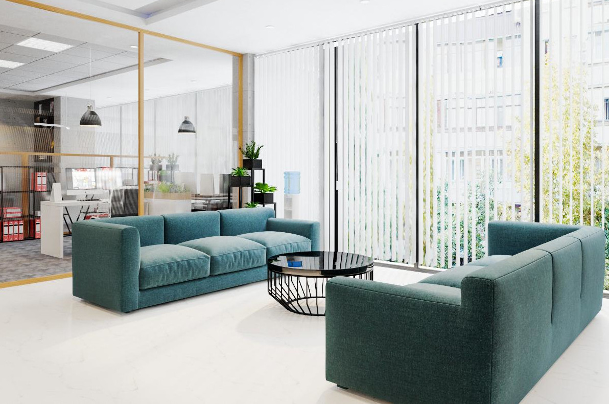 hình ảnh sảnh tầng 3 văn phòng đẹp ở Hà Nội với ghế sofa lớn màu xanh dương, bàn trà tròn bề mặt màu đen bóng