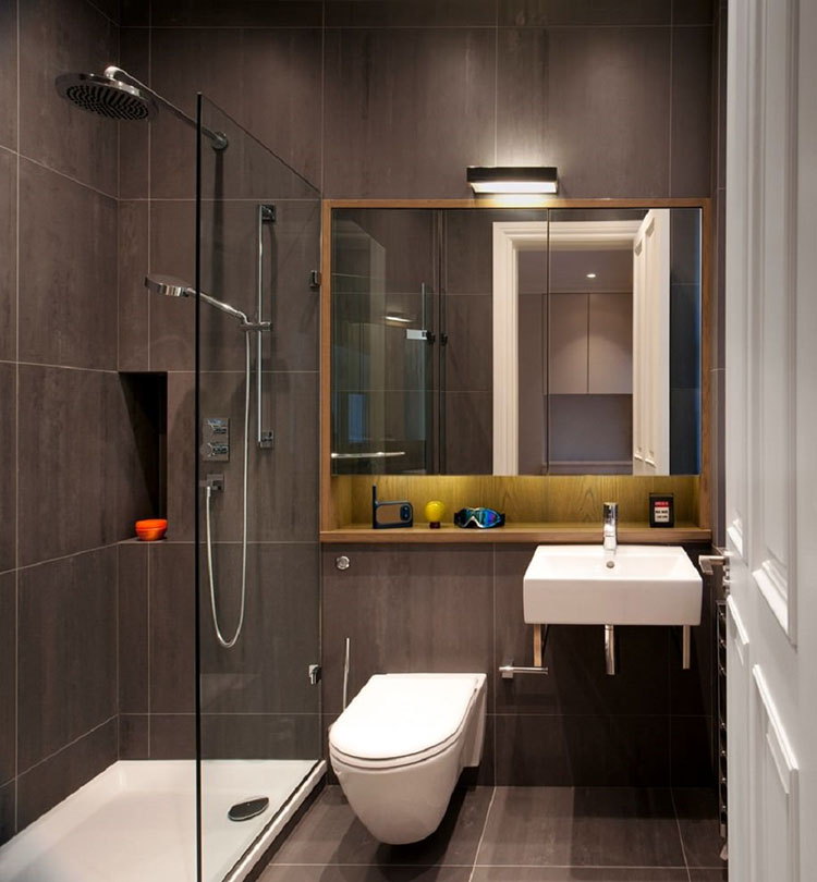 Phòng vệ sinh trong nhà vườn 1 tầng mái Thái được thiết kế theo phong cách hiện đại với buồng tắm kính tiện dụng.