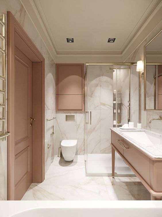 phòng tắm trong nhà ống 3 tầng với sàn và tường ốp gạch giả đá cẩm thạch màu trắng, cửa sơn màu hồng đất