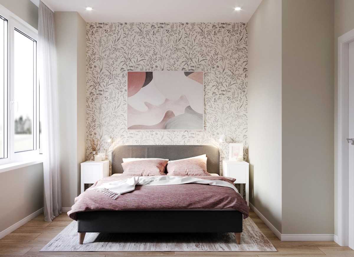 Điểm nhấn tinh tế của phòng ngủ sắc trắng chủ đạo chính là khu vực giường với ga gối màu hồng vỏ đỗ, tranh tường trừu tượng và giấy dán họa tiết lá cây nhỏ xinh.