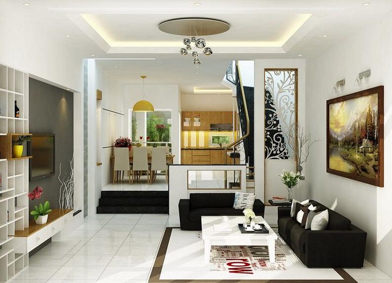 Phòng khách hiện đại, bài trí tối giản với điểm nhấn là bộ ghế sofa màu đen, bàn trà vuông màu trắng tương phản và tủ kệ tivi kiêm chức năng trang trí ở phía đối diện