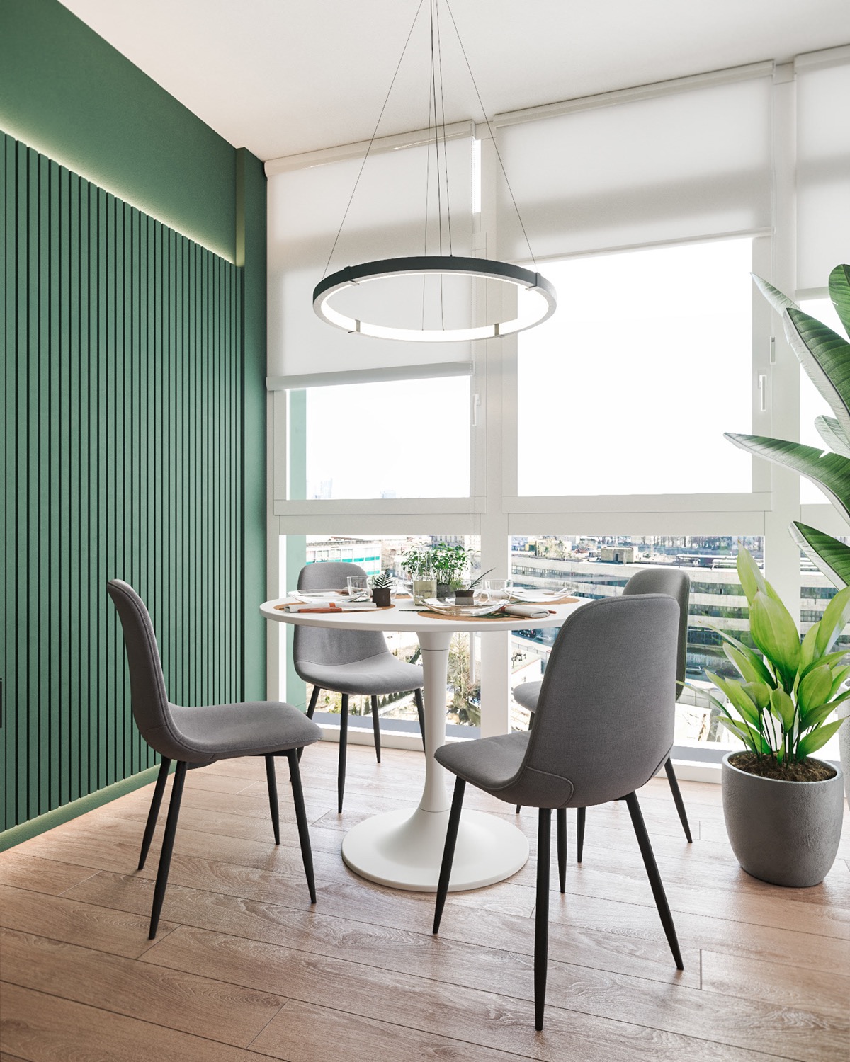 Bức tường sơn màu xanh lá kéo dài tới khu vực ăn uống trong căn hộ 90m2. Đèn thả hiện đại với hình dáng tương tự đường viền của bàn ăn tròn bên dưới.