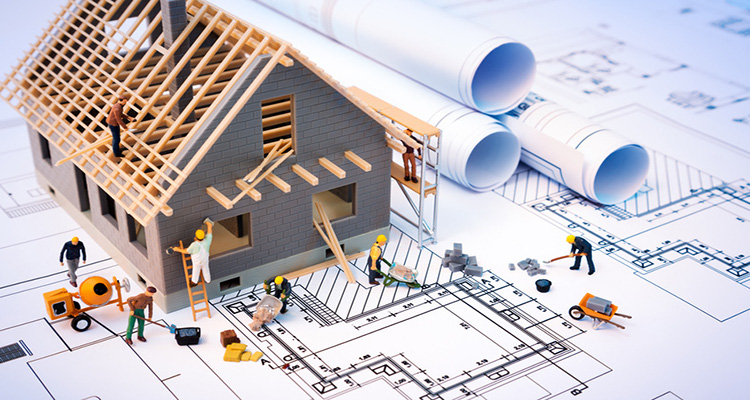 hình ảnh mô hình một ngôi nhà đang được đội thợ thi công, minh họa cho việc miễn giấy phép xây dựng