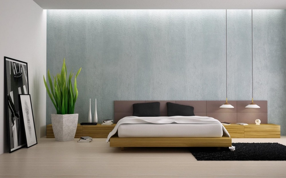 phòng ngủ phong cách tối giản với giường bệt bằng gỗ, tường đầu giường sơn màu hồng nhạt, chậu cây cảnh lớn