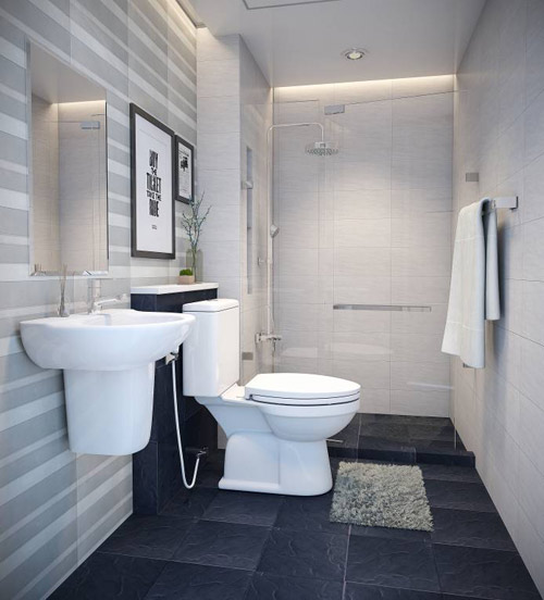Trong nhà cấp 4 mái Thái, phòng tắm kết hợp vệ sinh được thiết kế hiện đại, đầy đủ tiện ích thiết yếu. Gạch lát màu đen tăng chiều sâu cho không gian.