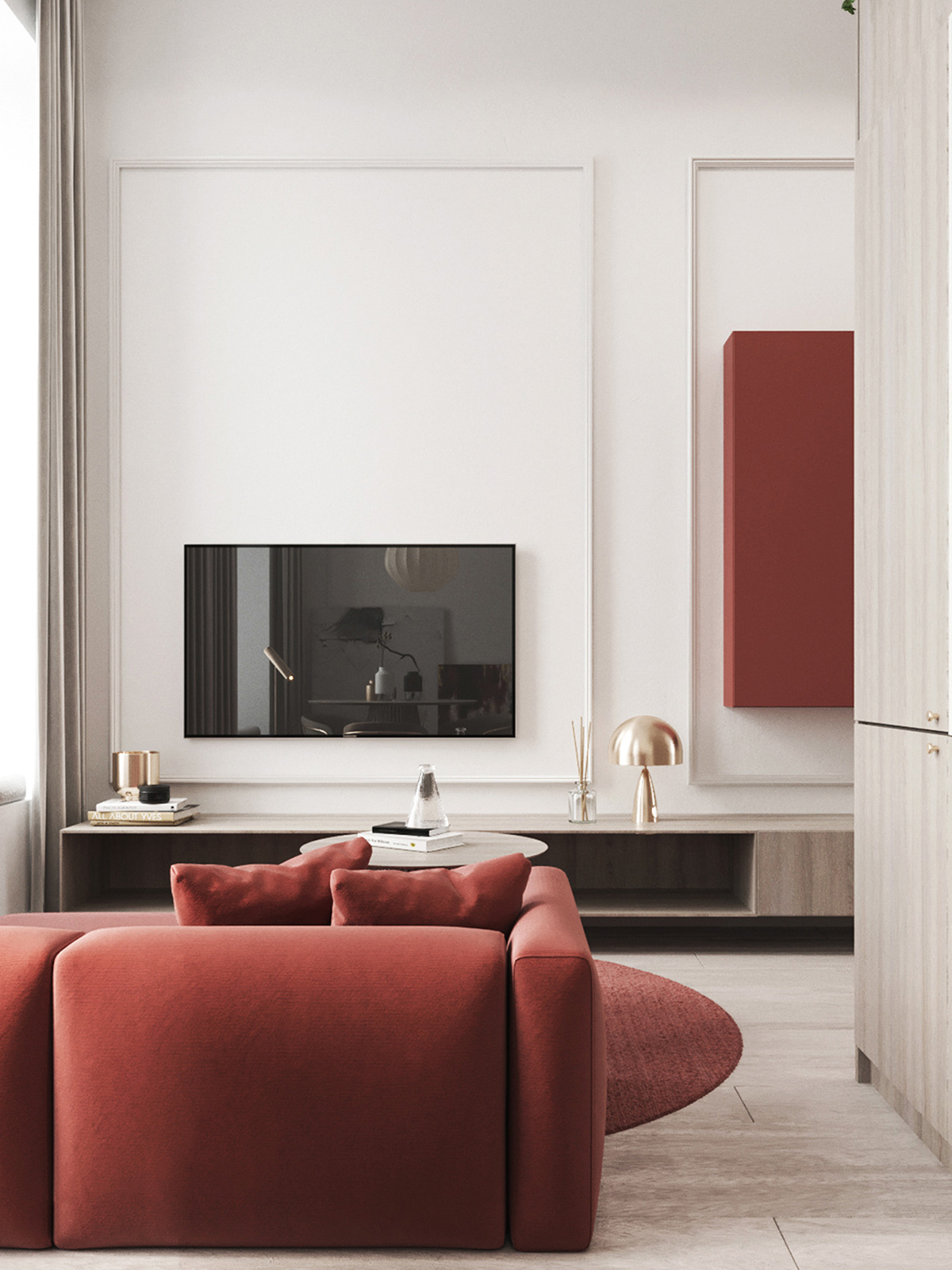 góc phòng khách với ghế sofa màu đỏ, tivi treo tường