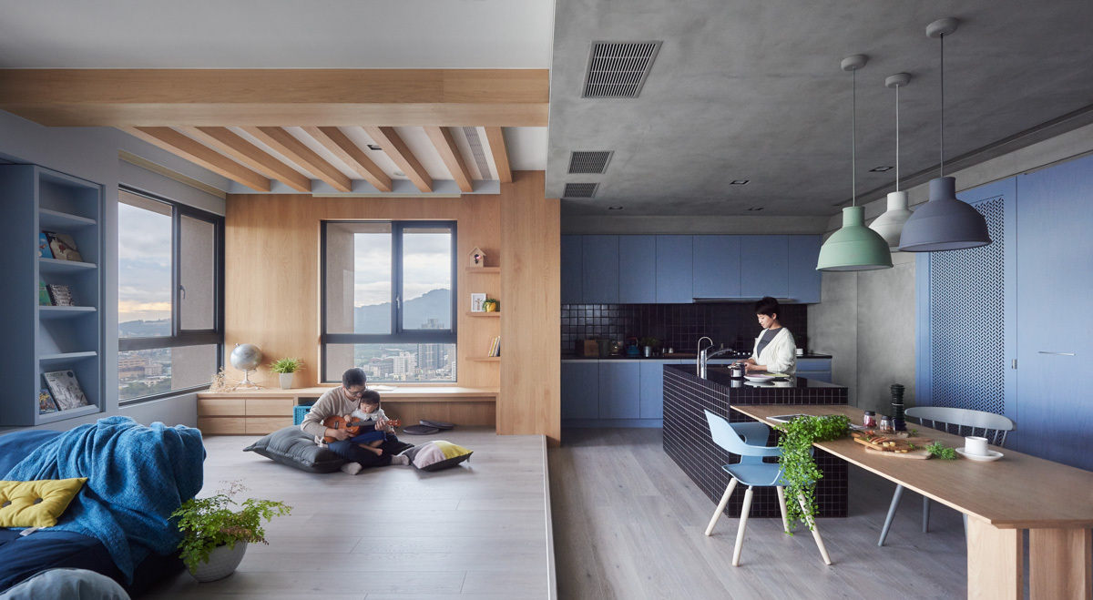 Không gian phòng bếp và bàn ăn phân tách tương đối với phòng khách, góc thư giãn bằng thiết kế sàn giật cấp tinh tế.