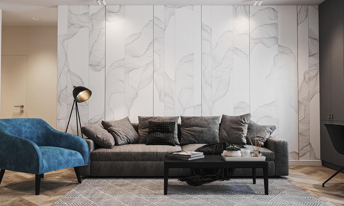 Vách tường thạch cao màu trắng với họa tiết trừu tượng tạo phông nền hoàn hảo cho không gian tiếp khách trong căn hộ nhỏ.