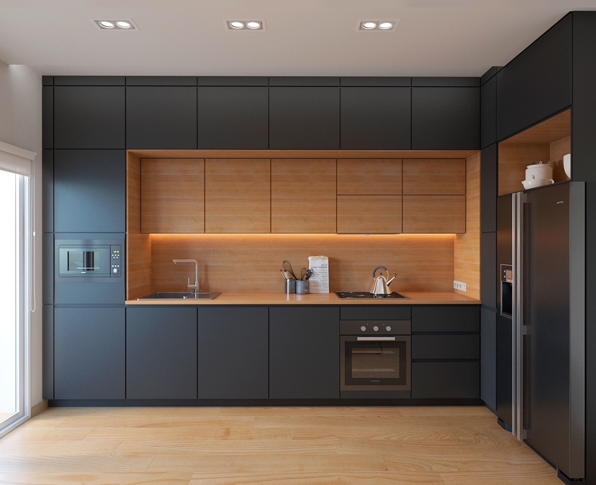 Phòng bếp sử dụng sắc đen xám chủ đạo nhưng không hề bị tối hay tạo cảm giác lạnh lẽo nhờ phần "khung" trung tâm bằng gỗ màu sáng ấm áp.