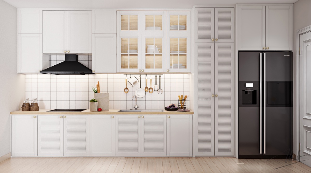 hình ảnh phòng bếp màu trắng chủ đạo với tủ bếp cửa chợp, máy hút mùi màu đen