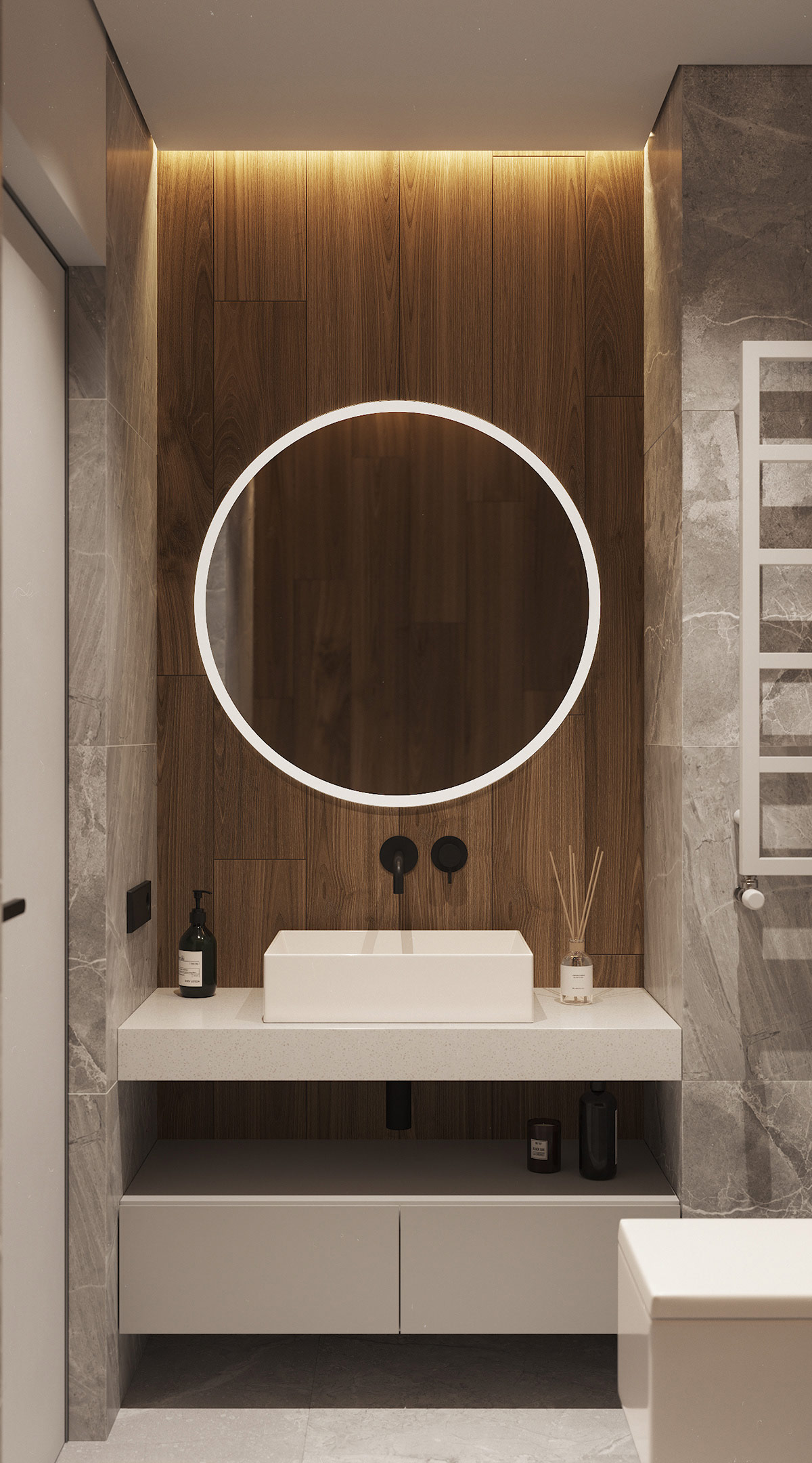 Khu vực bồn rửa mặt nổi bật với gương tròn gắn đèn LED ánh sáng trắng, tương phản với tấm ốp gỗ sẫm màu.