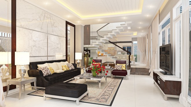 Phòng khách nhà ống 3 tầng được thiết kế theo phong cách truyền thống kết hợp yếu tố hiện đại, nổi bật với bộ ghế sofa da màu đen sang trọng.