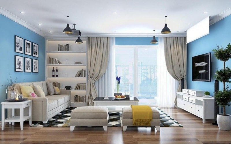 hình ảnh phòng khách nhà ống 4 tầng với trần màu trắng, tường xanh dương, sofa, tranh tường, thảm trải họa tiết hình học