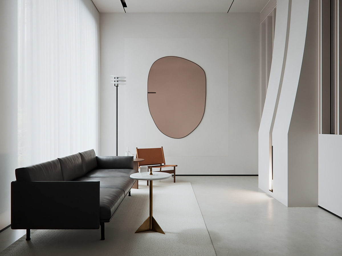hình ảnh phòng khách căn hộ tối giản với tường trắng, sofa da đen, bàn cà phê tròn, tranh hình dạng trừu tượng treo tường