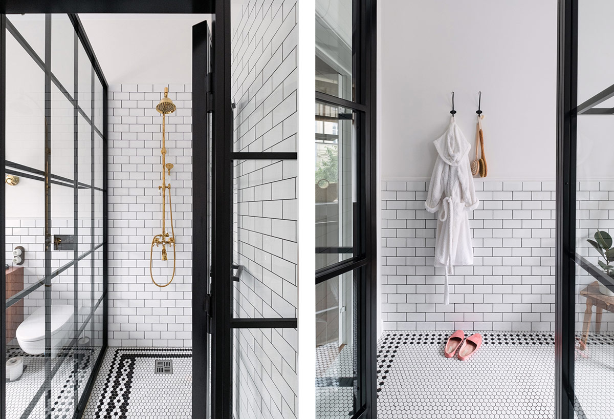Phòng tắm sử dụng hai màu đen - trắng hiện đại, cá tính làm nền cho thiết bị màu vàng đồng trở nên nổi bật, hút mắt hơn.