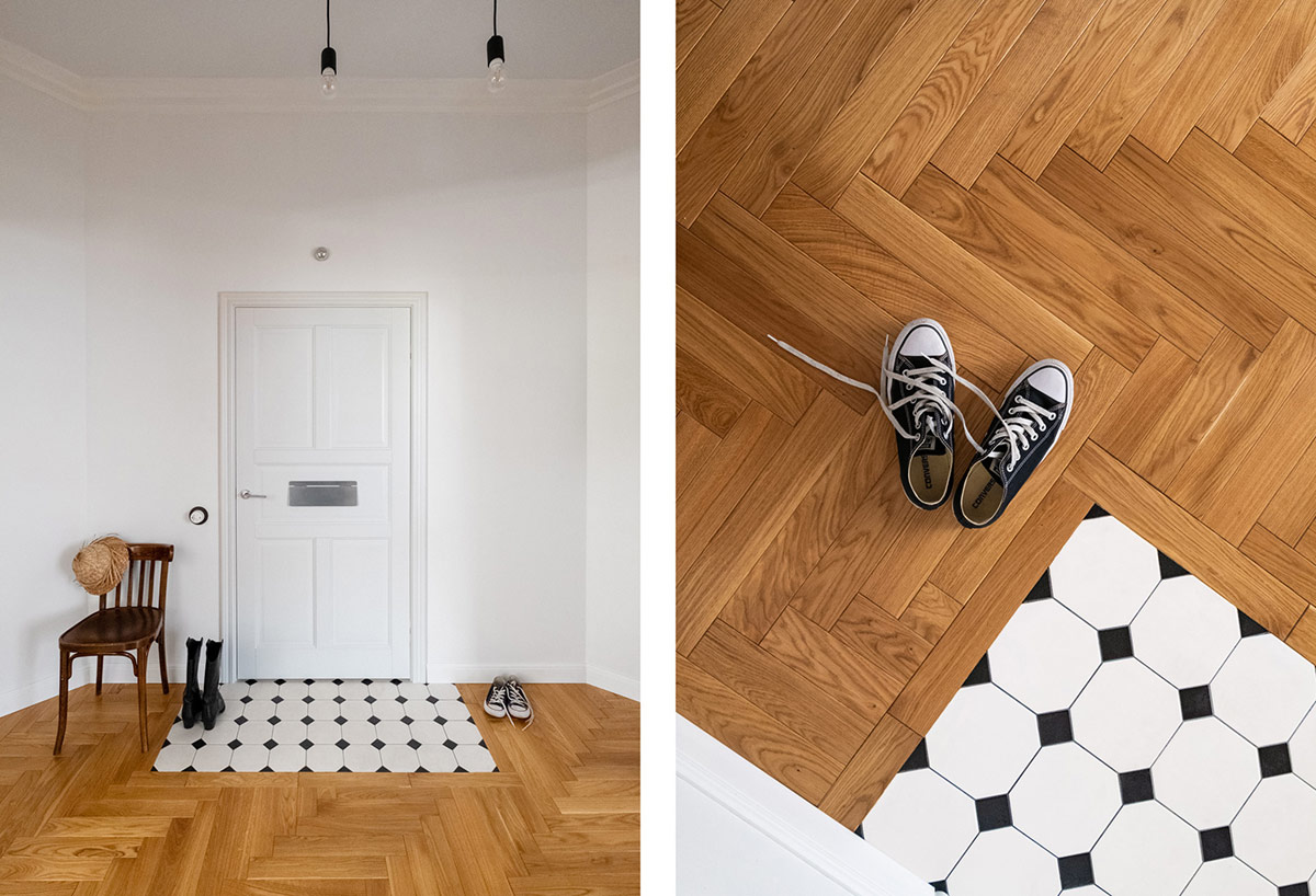 Lối vào căn hộ nổi bật với thảm trải hình dáng gạch lát sàn màu đen - trắng.