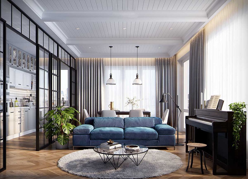 hình ảnh phòng khách rộng rãi, thoáng sáng với bộ ghế sofa màu xanh lam, đèn thả trần cổ điển, đàn piano, bàn trà và thảm trải tròn mềm mại