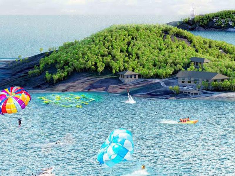hình ảnh minh họa cho Khu du lịch đảo Hòn Đất với cây xanh, dù lượn trên biển