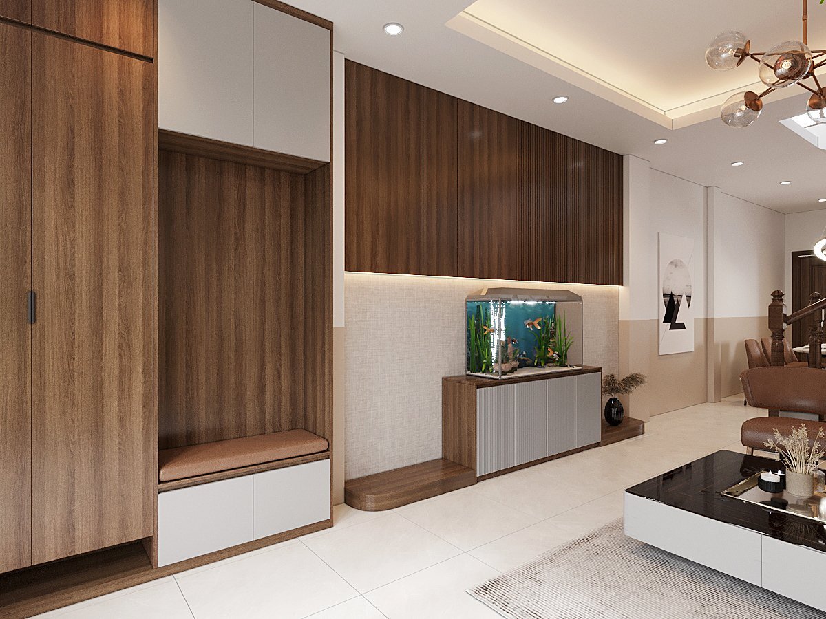 Không gian ở lối vào nhà được tận dụng một cách tinh tế, khéo léo với hệ tủ lưu trữ cao kịch trần, tông màu nâu gỗ ấm áp, thân thiện.