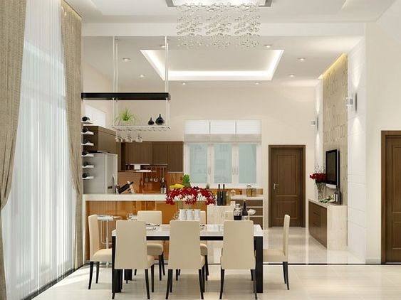 Mẫu thiết kế nội thất phòng bếp + ăn hiện đại, sang trọng và ấm cúng. Quầy bar nhỏ ngăn cách giữa bếp và bàn ăn.