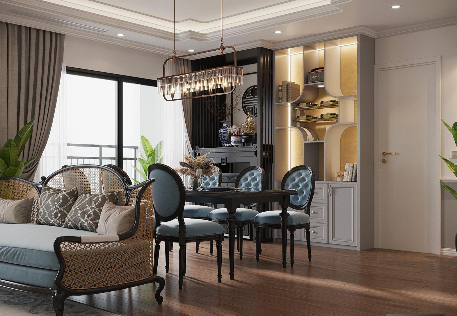 Phòng ăn căn hộ 150m2 có cửa kính cao rộng mở ra ban công thoáng đãng, ngập tràn ánh sáng tự nhiên. Đệm ghế sofa và ghế ăn cùng tông xanh dương nhẹ nhàng, giúp kết nối liền mạch giữa hai không gian chức năng.