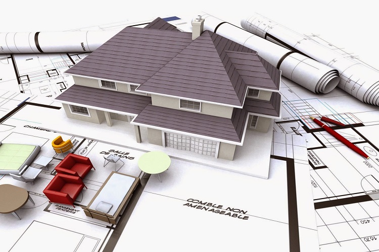 hình ảnh cận cảnh mô hình ngôi nhà với mái ngói xám đặt trên bản vẽ thiết kế