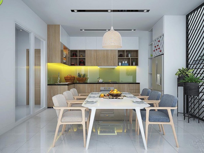 Không gian bếp kết hợp phòng ăn hiện đại, ấm cúng. Tường chắn bếp ốp vật liệu kính sáng bóng, tông màu cực bắt mắt.