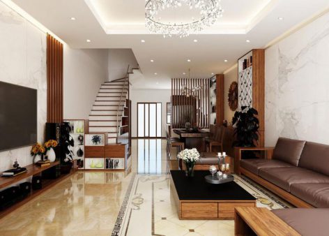 Phòng khách và bếp được thiết kế liên thông với diện tích rộng rãi, thoáng đãng và nhiều ánh sáng tự nhiên. Cầu thang lên tầng 2 nằm gọn xinh bên trái nhà.