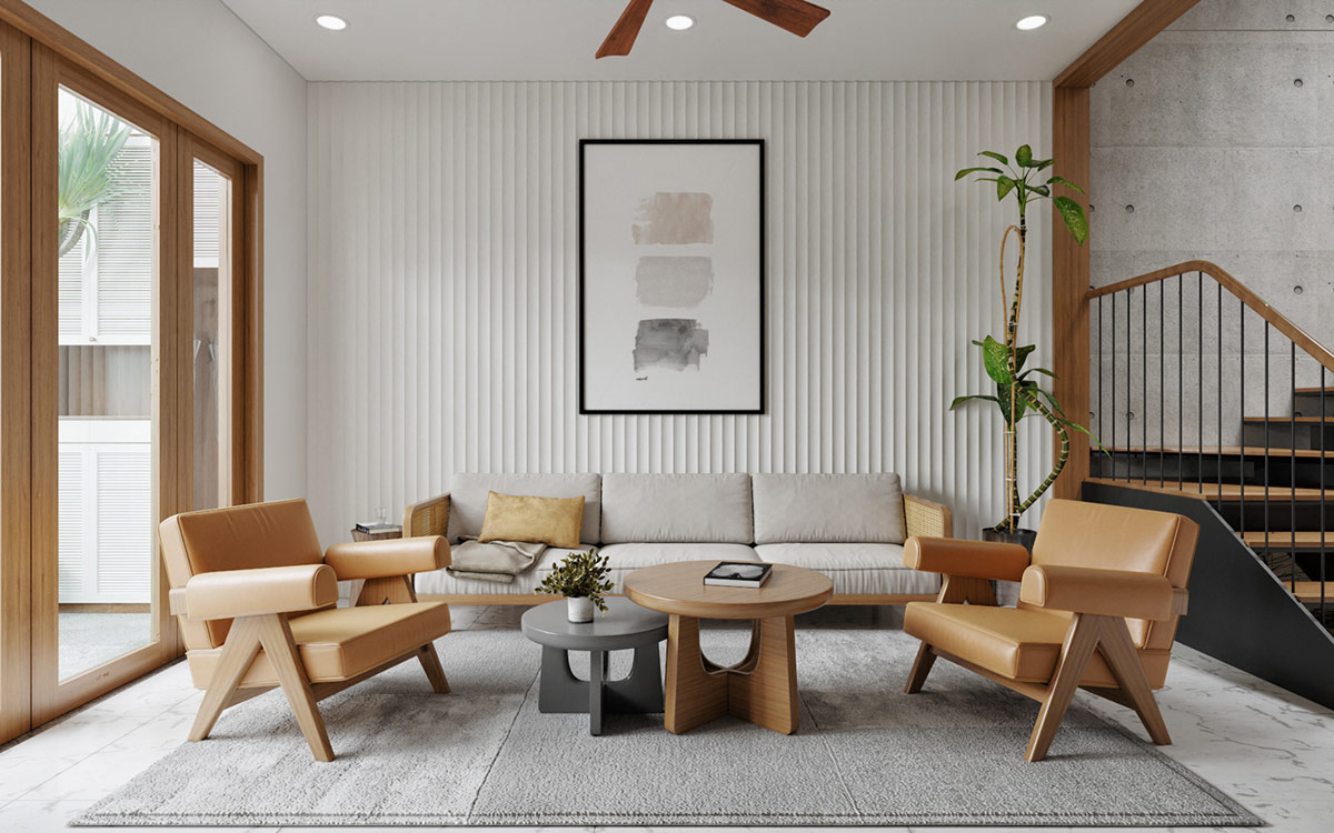 Ghế bành trong phòng khách tương phản màu sắc với thảm trải sàn màu ghi lạnh. Cặp bàn cà phê tròn lồng vào nhau tạo nên cặp đôi tương phản ở trung tâm của không gian tiếp khách phong cách mở phóng khoáng.