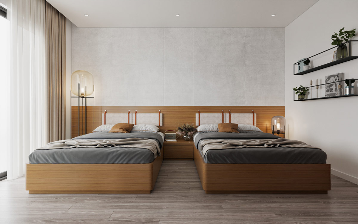Phòng ngủ 2 giường đơn được trang trí với gam màu xám và nâu gỗ ấm áp. Bộ đôi đèn sàn bất đối xứng về kích thước tạo điểm nhấn cho căn phòng.