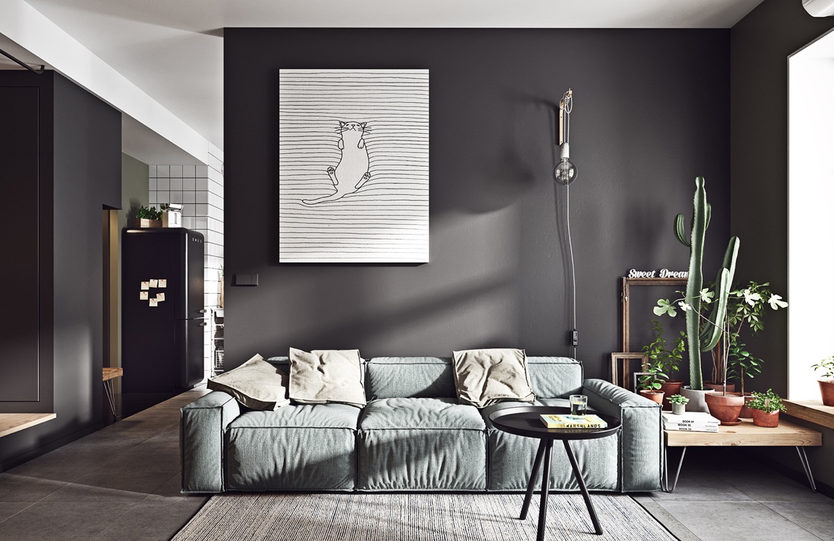 Thiết kế nội thất phòng khách phong cách Scandinavian tối giản với bức tường màu đen tuyền táo bạo và cá tính. Loạt chậu xương rồng trên kệ gỗ cạnh sofa tựa như một khu vườn "mini" mát mắt.