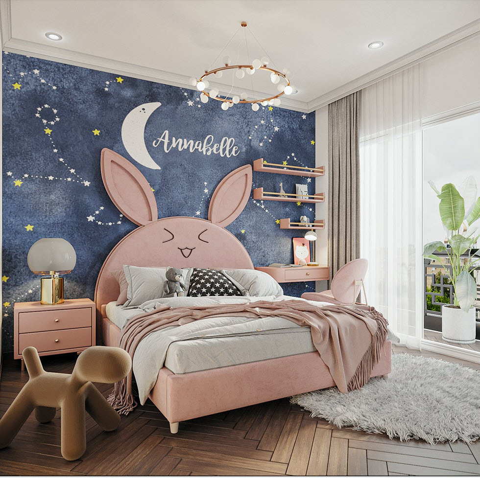 Phòng khách với giường hình thỏ hồng, tường màu xanh lá dán sao