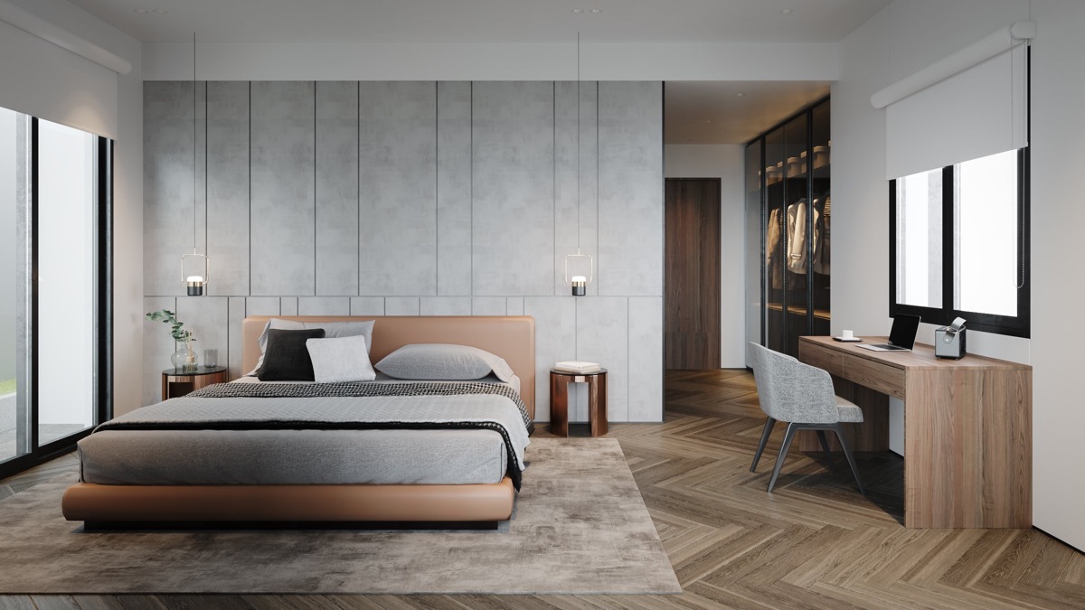 Một tấm thảm phòng ngủ màu be dễ dàng kết hợp với sàn gỗ xương cá chevron.