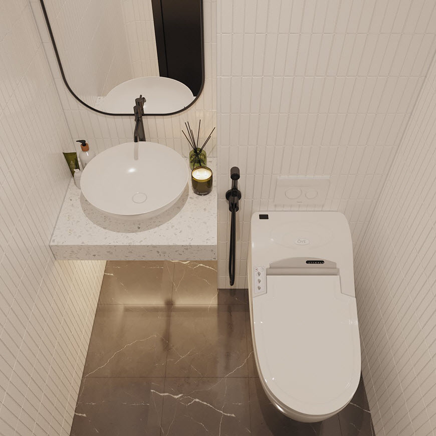 Phòng vệ sinh khác với thiết kế tối giản, sử dụng bảng màu trắng xám sang trọng.