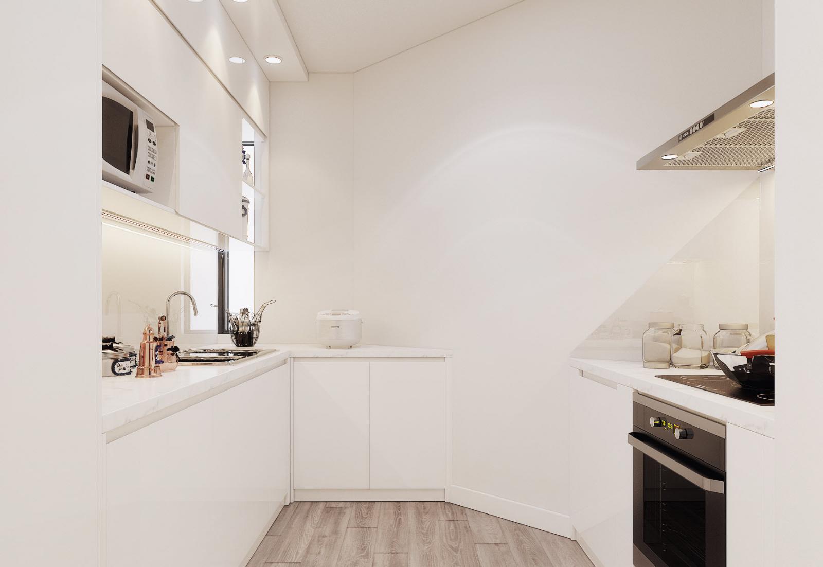 Kiến trúc sư khéo léo sử dụng bảng màu trắng tinh khôi cho phòng bếp, nhằm tạo cảm giác rộng rãi hơn một cách trực quan.