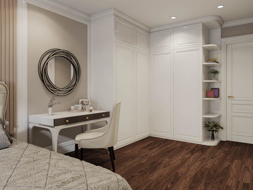 Tủ quần áo liền tường tông màu trắng tinh khôi tạo hiệu ứng rộng rãi hơn cho căn phòng.