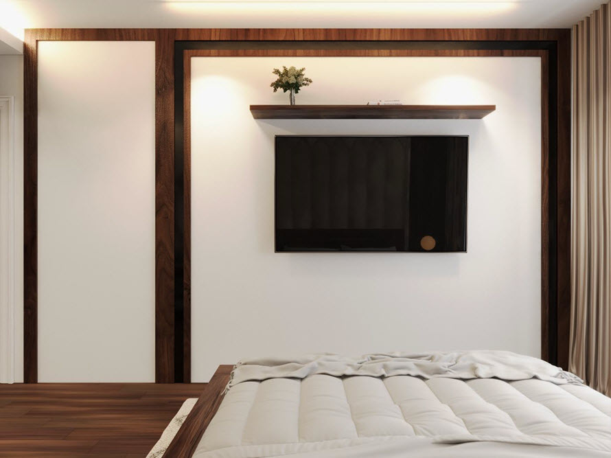 Tương tự phòng master, phòng ngủ này cũng sử dụng tivi gắn trực tiếp lên tường thay vì tủ kệ cồng kềnh, tạo độ thông thoáng cho mặt sàn.
