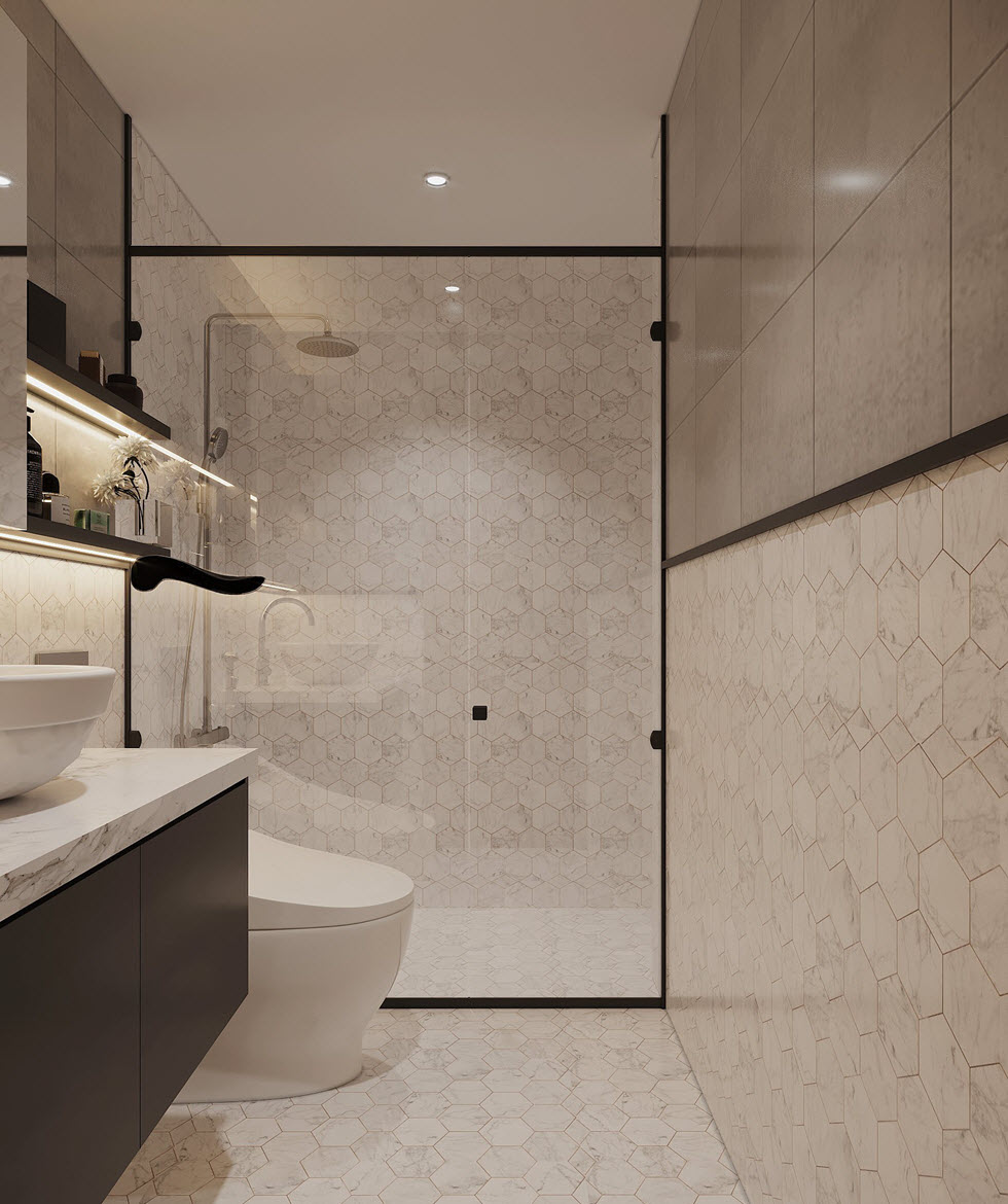 hình ảnh một góc phòng tắm với vòi sen, tường kính cường lực trong suốt, bo viền khung đen nổi bật.