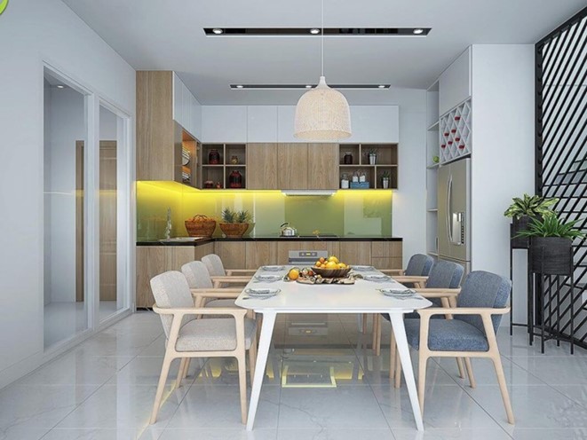 Phòng bếp kết hợp phòng ăn rộng thoáng, ấm cúng với điểm nhấn là tường ốp bếp tông màu xanh lá nhẹ nhàng. Bàn ghế ăn phong cách Bắc Âu hiện đại, tinh tế.