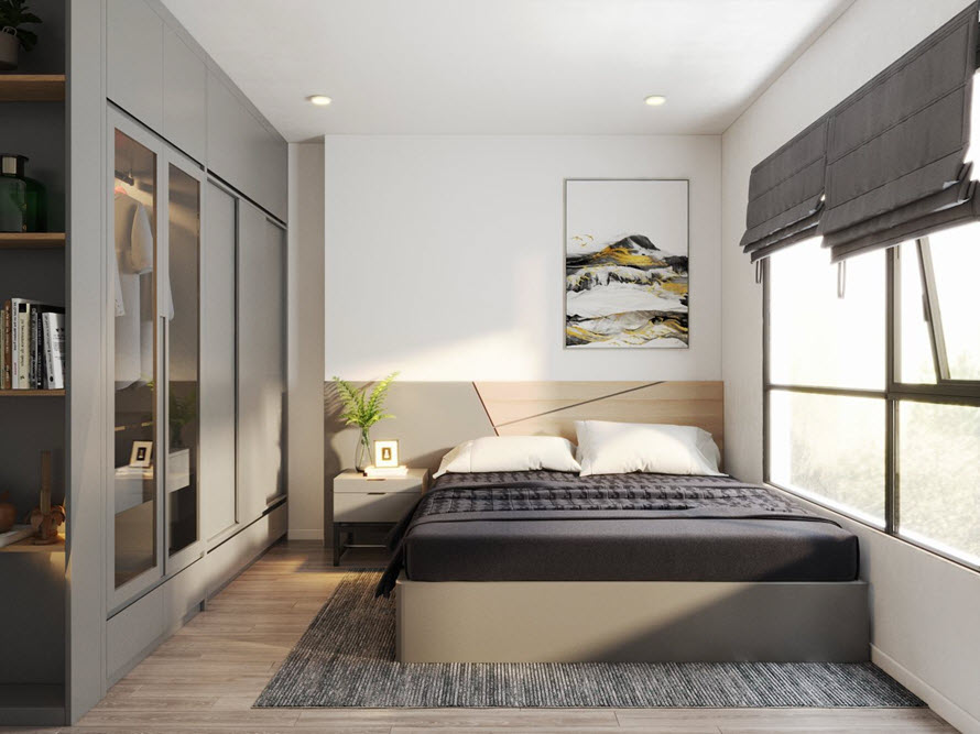 Phòng ngủ thứ hai trong căn hộ được thiết kế với bảng xám - trắng trẻ trung hơn. Khung cửa sổ kính lớn cho phép ánh sáng tự nhiên ngập tràn căn phòng.