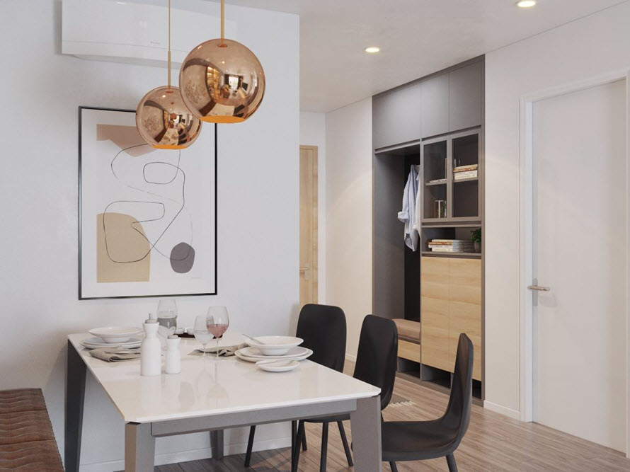 Bộ đèn thả mặt dây chuyền tông màu vàng đồng sáng bóng càng giúp tôn lên vẻ sang trọng, hiện đại của thiết kế nội thất trong căn hộ này.