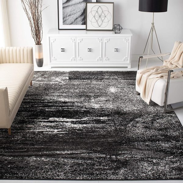 Thảm trải sàn phòng khách với tông màu đen, trắng tối giản, trừu tượng phù hợp với không gian hiện đại.