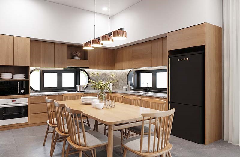 Không gian bếp và phòng ăn tích hợp trong một, sử dụng nội thất gỗ ấm áp. Căn phòng ngập tràn ánh sáng tự nhiên làm tôn lên vẻ đẹp của đường nét nội thất.