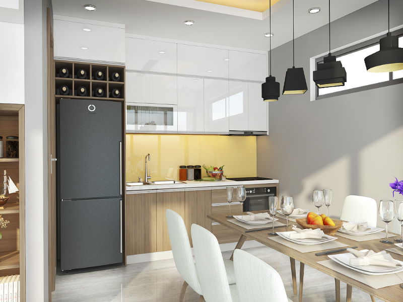 Phòng bếp kết hợp phòng ăn với gam màu sáng và kính ốp bếp màu vàng là điểm nhấn hút mắt cho không gian chức năng này.