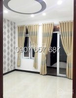 Bán nhà 3 lầu, DT 200m2, 4 phòng ngủ, sân thượng, hướng Đông Nam, đường Huỳnh Tấn Phát, giá 2.65 tỷ 7692169