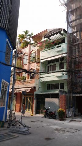 Xuất ngoại bán gấp nhà 4 tầng MT đường Nguyễn Đức Thuận, P. 13 12247016