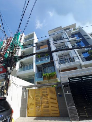 Cần bán gấp tòa nhà 6 tầng góc ngã tư Nguyễn Văn Trỗi - Trần Huy Liệu, 4x20m, 25 tỷ TL có HĐT 60tr 13310652